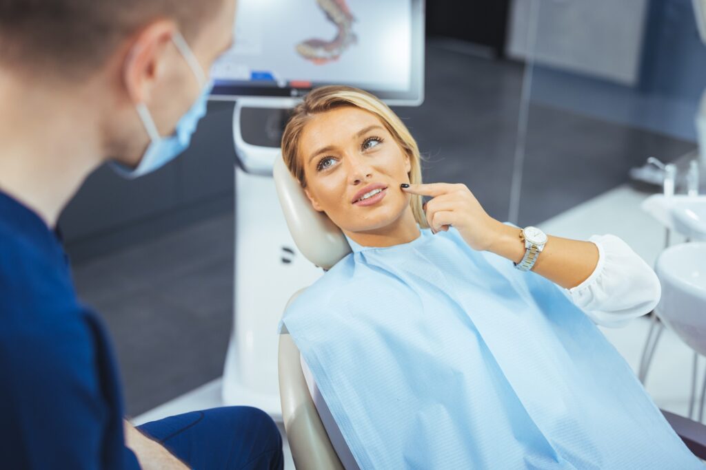 Woman talking to dentist during consultation